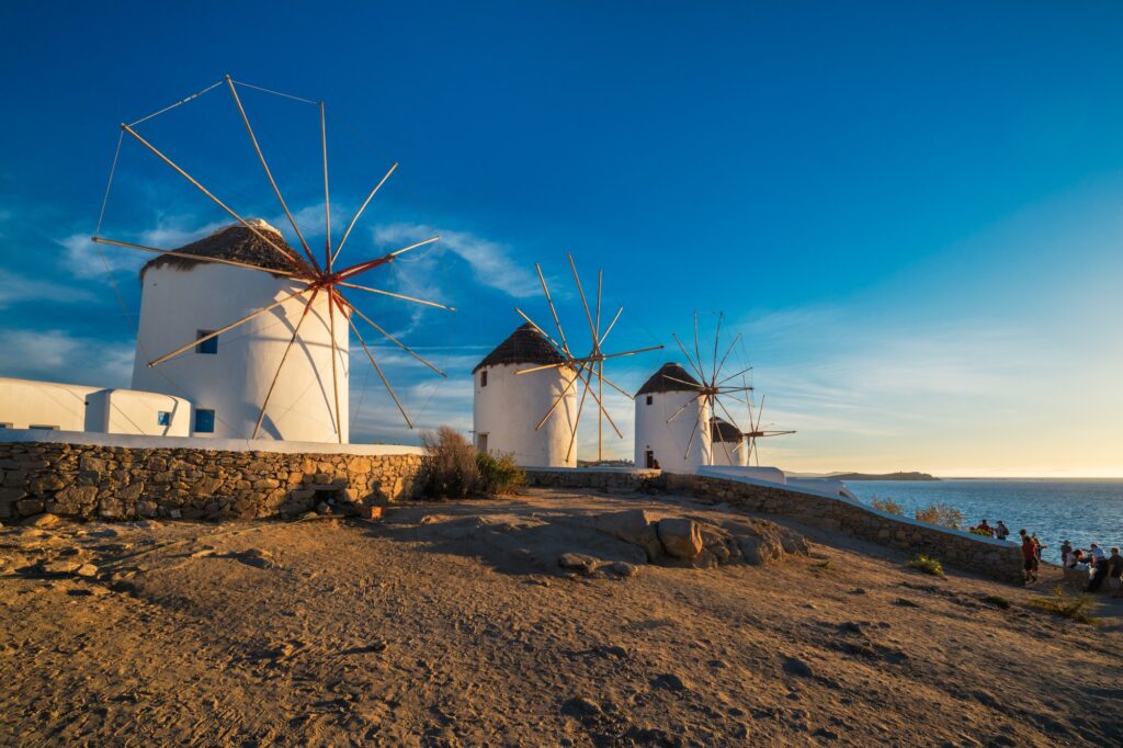 Traditional greek windmills on Mykonos island at sunrise, Cyclades, Greece